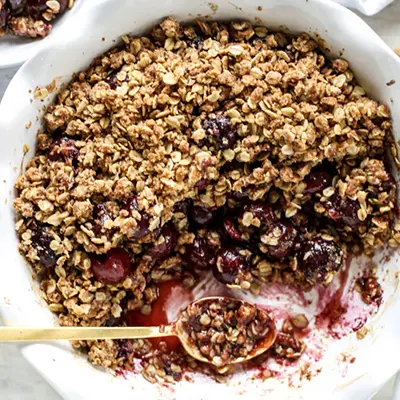 Types of pies with a bowl of cherry crisp.