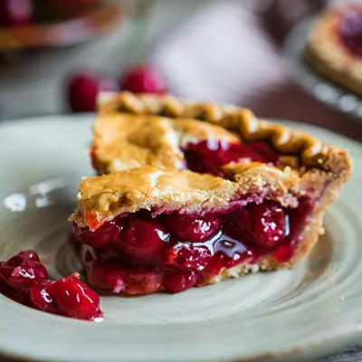 Types of pies with a slice of cherry pie.