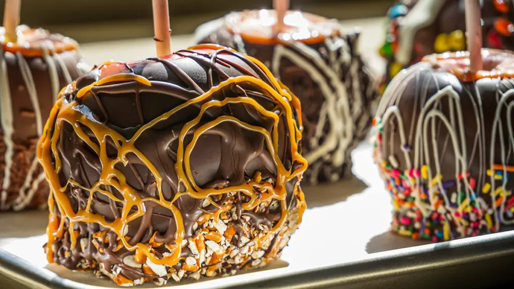 Flavor pairings with several chocolate caramel apples on a plate.
