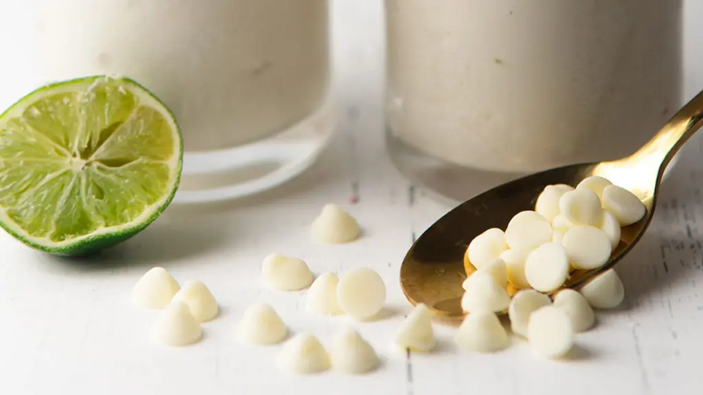 Flavor pairings with white chocolate and lime on a counter.