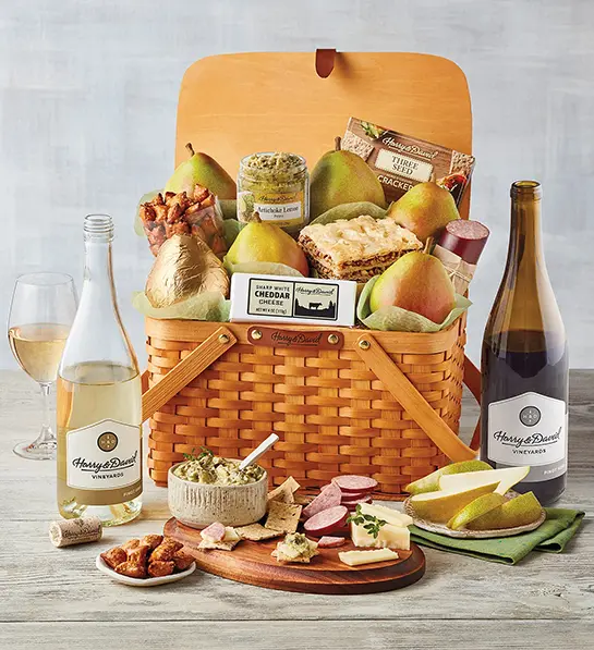 Pinot Gris with a picnic basket full of pears, snacks, and other snacks.