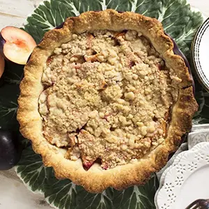 Plum pie on a table.