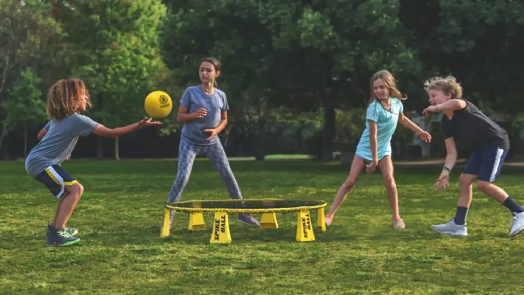 Kids playing a ball game in the summer sunshine.