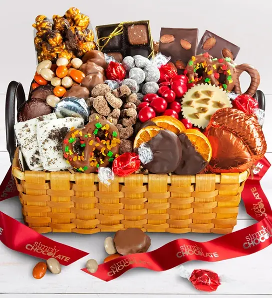 Fall gifts with a basket of chocolate sweets and other goodies.