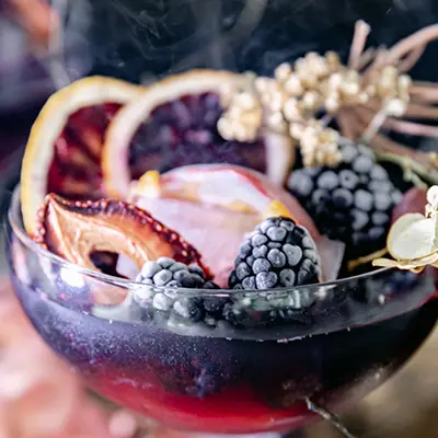 Halloween recipe with a black sangria cocktail with granishes.