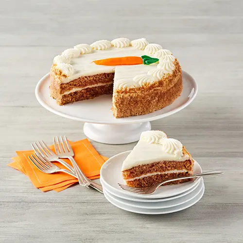 Types of cake with a carrot cake on a platter.