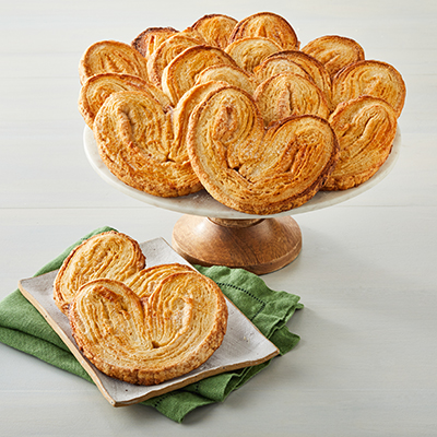 Types of pastries with a platter of palmiers.