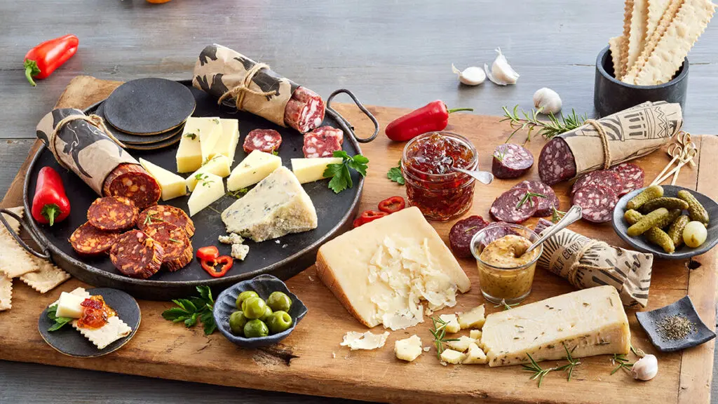 Cheese gifts on a wooden board.