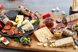 Cheese gifts on a wooden board.