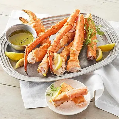 Plate of Alaskan crab legs with butter.