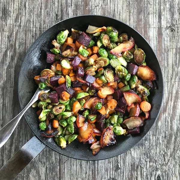 Sweet potato vegetable hash in a skillet.