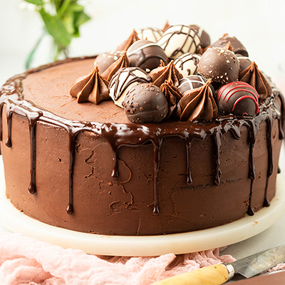 Love chocolate with a chocolate cake topped with truffles.