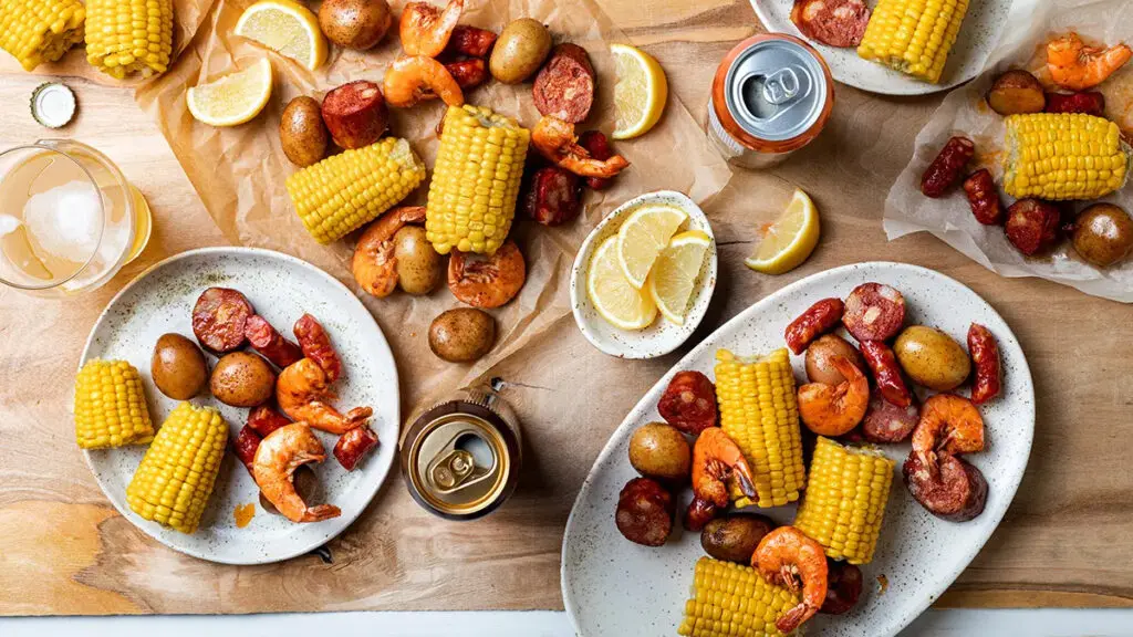 Spring break ideas with a low country boil on plates and platters.