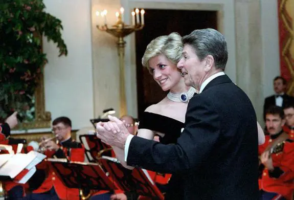 Princess Diana and President Reagen dancing at a state dinner.