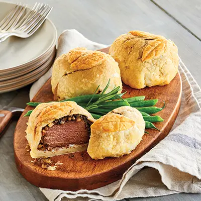 Winter wine pairings with mini beef Wellingtons on a platter.