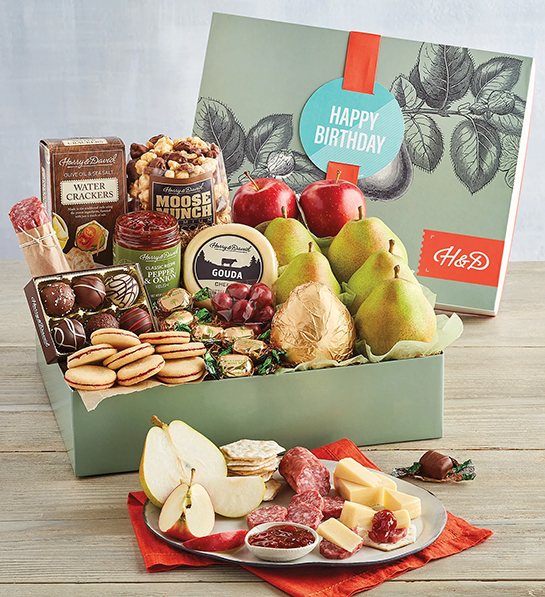 40th birthday ideas with a box of fruit, chocolate, cheese, and other snacks.