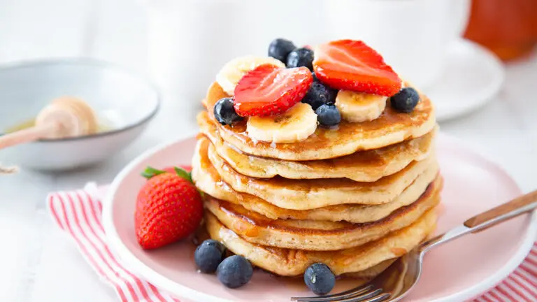 Homemade pancakes with berries and banana