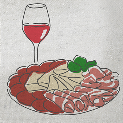 Eat like an Italian with a spread of cured meats and cheeses next to a glass of wine.