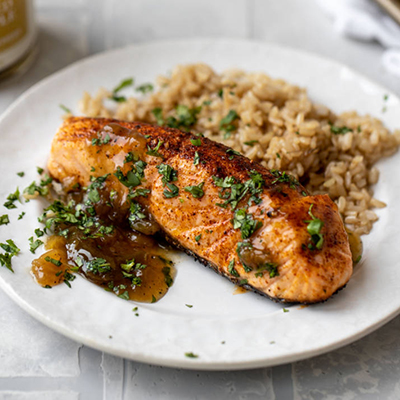 Pineapple recipes with a plate of grilled salmon and rice.