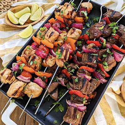 Pineapple recipes with a platter of kebabs on a table.
