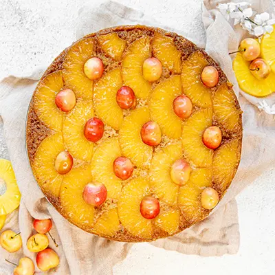 Pineapple upside down cake on a platter.
