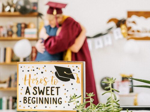 Graduation party ideas with two people hugging at a graduation party.
