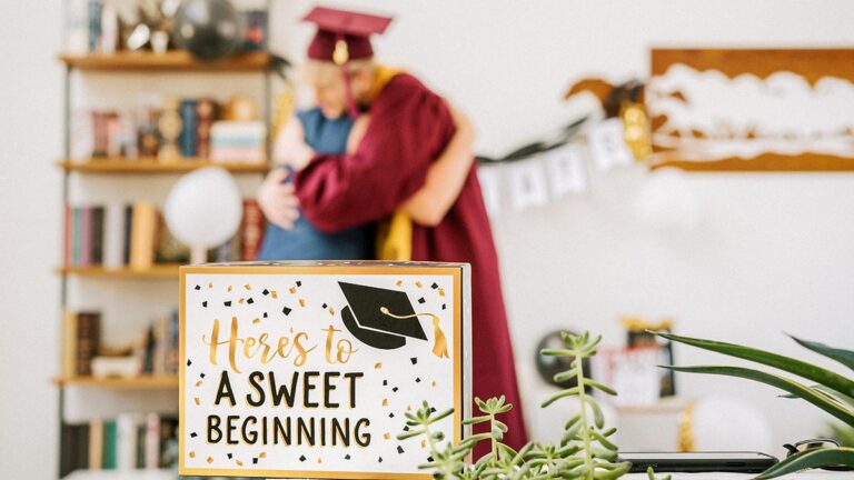 Graduation party ideas with two people hugging at a graduation party.
