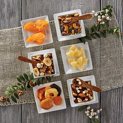 Ways to use dried fruit with several containers of dried fruit and nuts.